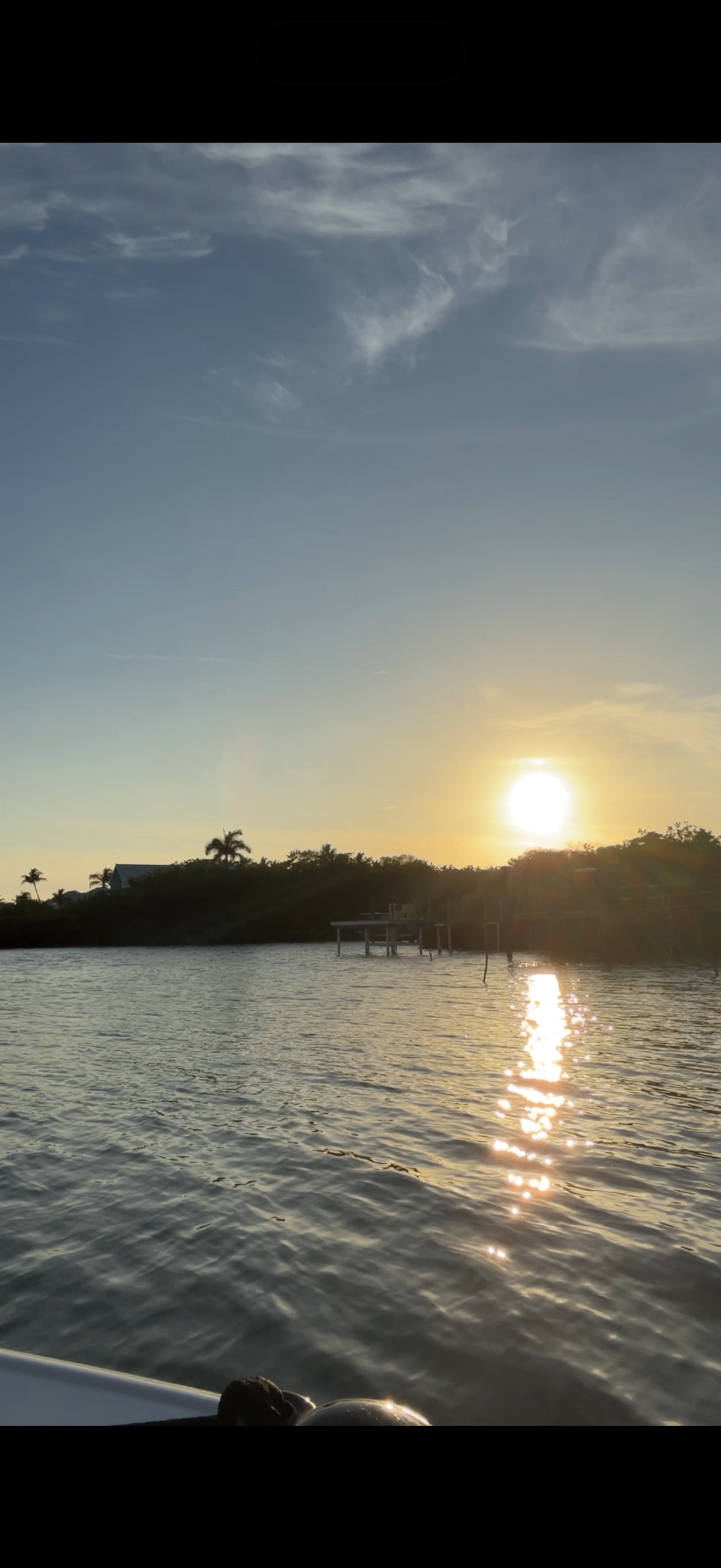 Sunset over the water from a boat