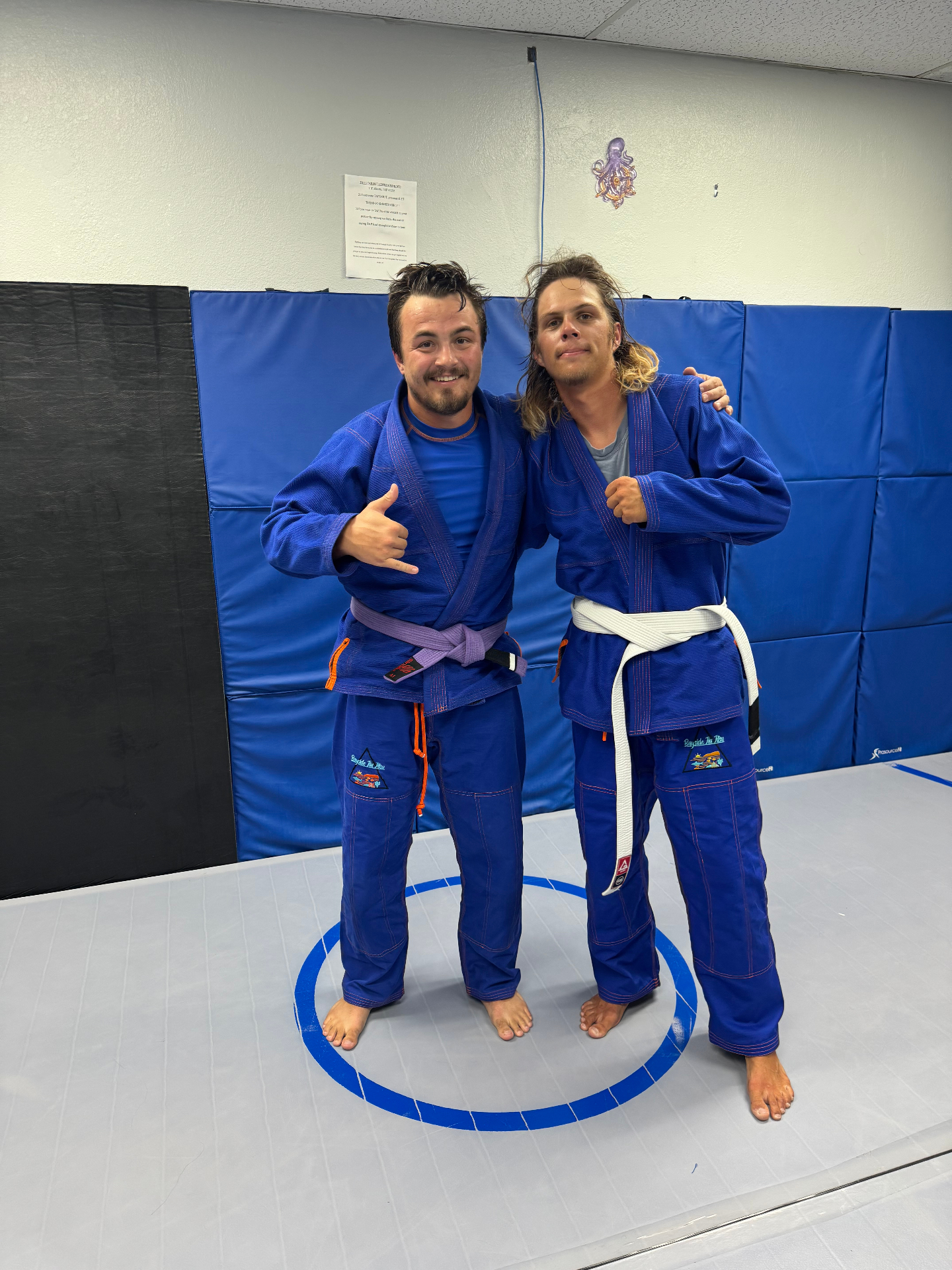 Two teammates in Bayside Jiu Jitsu gis