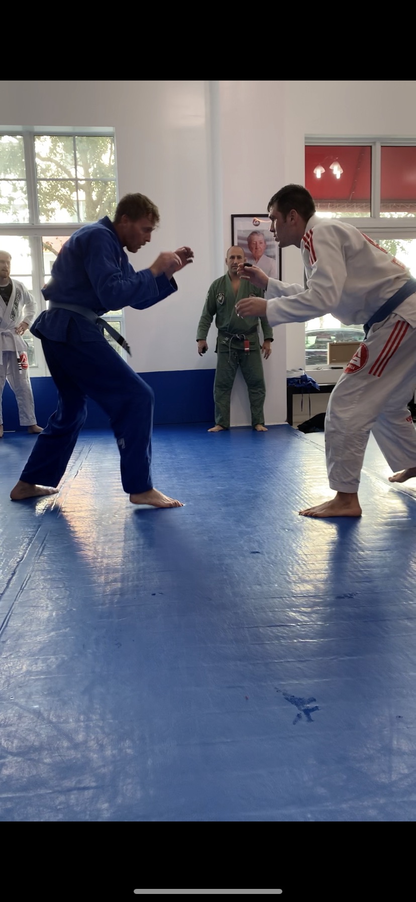 Two grapplers facing off on the mats