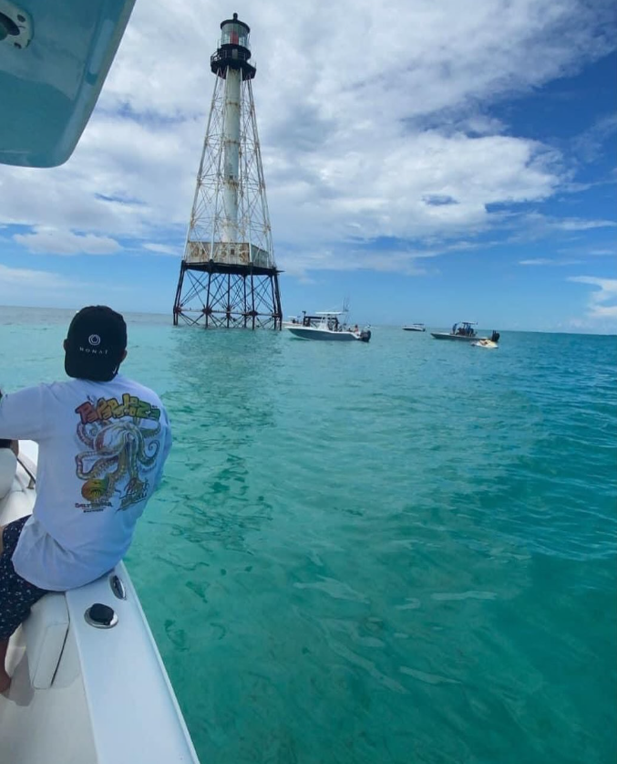Angler watching Alligator Reef Lighthouse from a boat