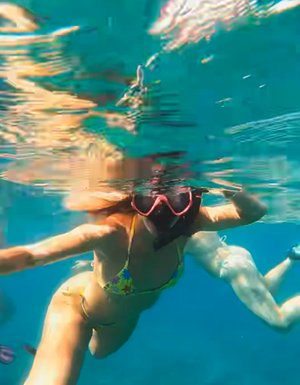 Snorkeler exploring clear tropical water