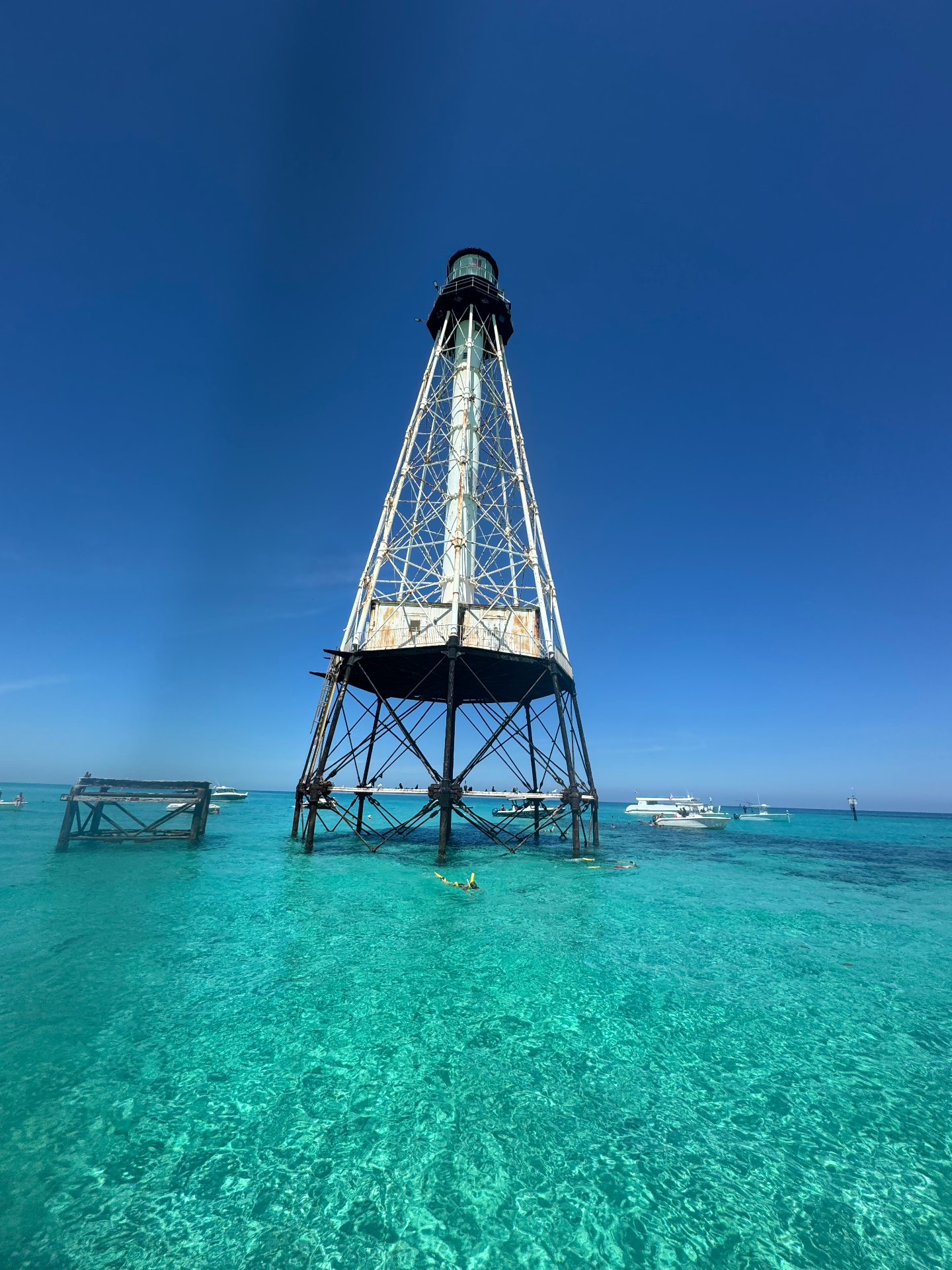 Alligator Reef Lighthouse rising over clear turquoise water